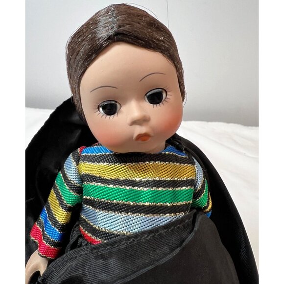 Madame Alexander Collectible Doll With Black Cape & Colorful Striped Dress - Picture 2 of 3